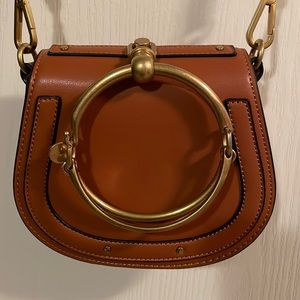 Small crossbody saddle bag. Never used